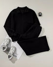 Front flat lay of UrbanFlow zip jacket and pant set in black