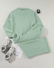 Back flat lay of UrbanFlow zip jacket and pant set in sage