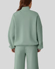 Back view of UrbanFlow zip jacket and drawstring pants set in sage