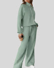 Front angle view of UrbanFlow two-piece jacket and pant set in sage
