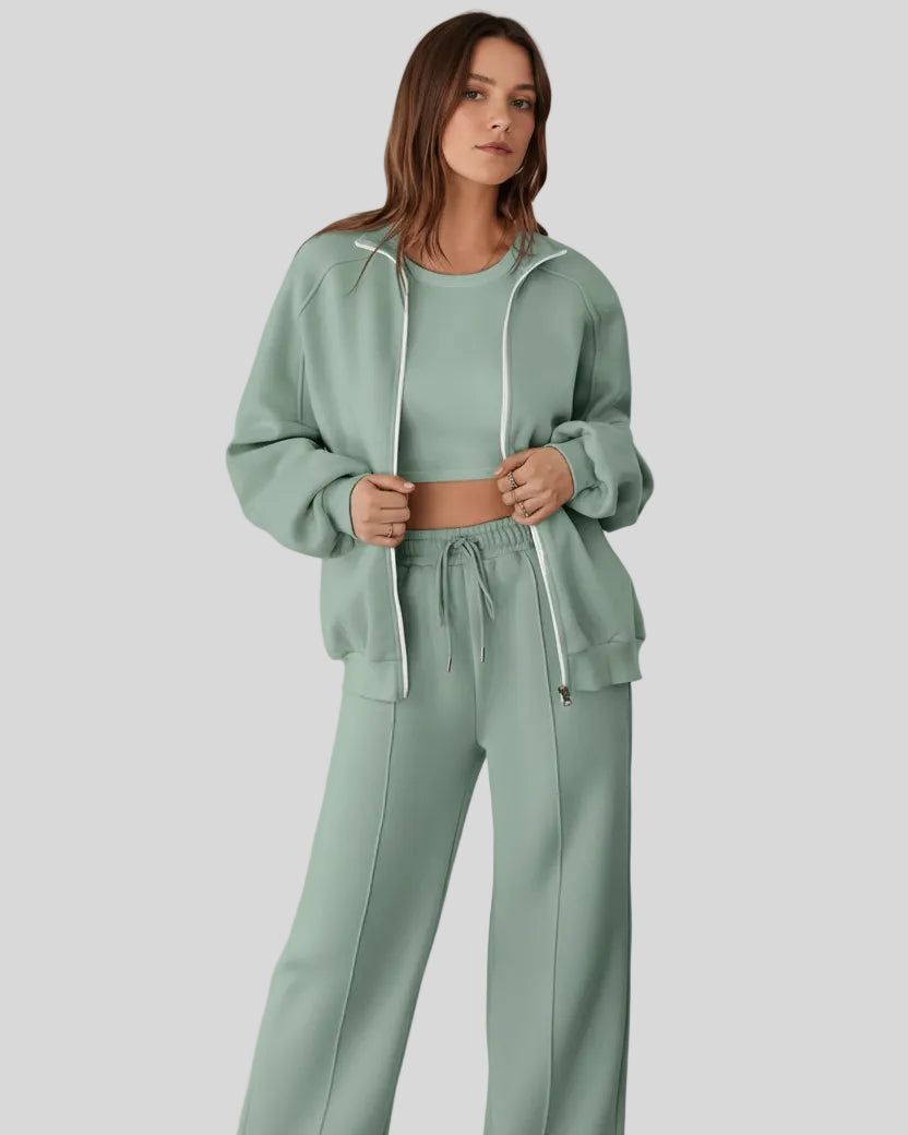 Model wearing UrbanFlow zip jacket and drawstring pants set in sage, jacket worn open