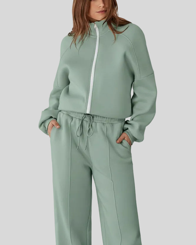 Front view of UrbanFlow zip jacket fully zipped with matching pants in sage