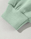 Sleeve close-up highlighting sleeve cuff of UrbanFlow jacket in sage