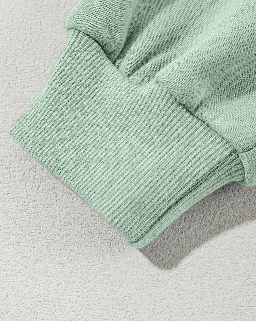 Sleeve close-up highlighting sleeve cuff of UrbanFlow jacket in sage
