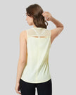 VeilBack Active Tank back view with cutout design and sheer detail in pastel yellow