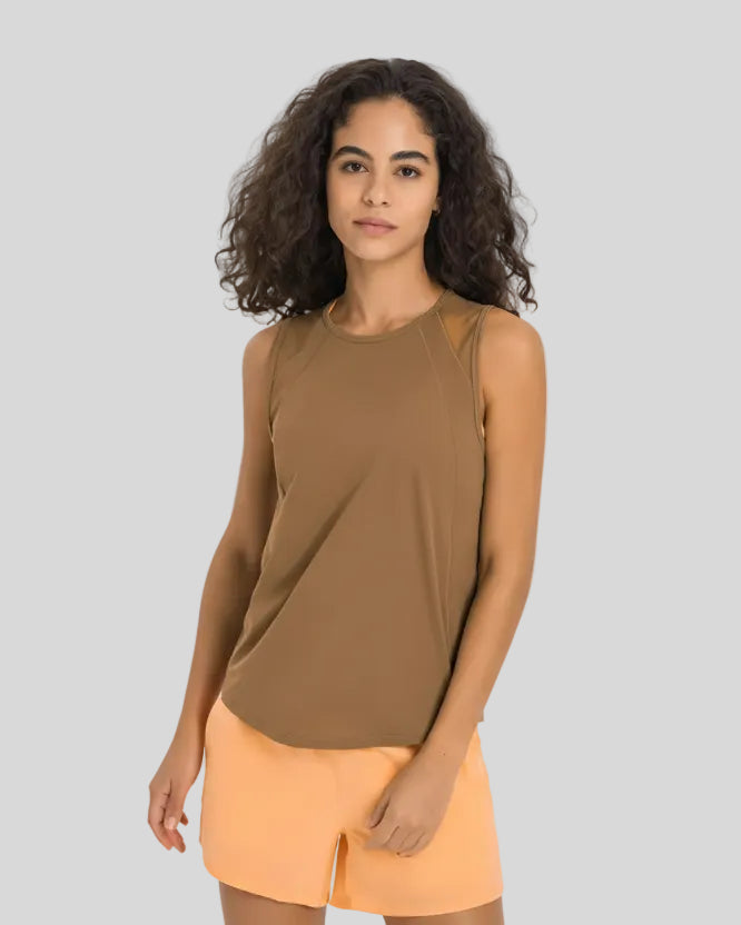 VeilBack Active Tank front angle showing lightweight drape and sleeveless cut in camel