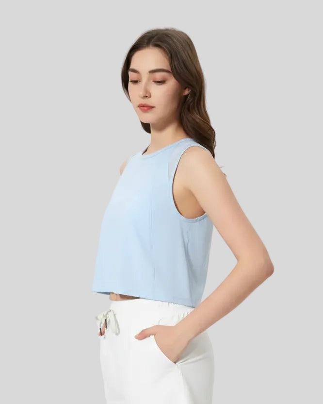 Side view showing cropped length of VeilBack Active Tank in Baby Blue