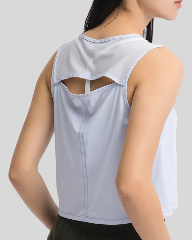 Close-up of sheer cutout back detail on light blue VeilBack Cropped Active Tank