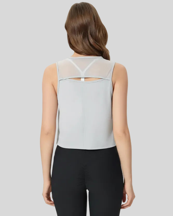 Back view of light gray VeilBack Cropped Active Tank with sheer cutout detail