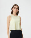 Angled front view of VeilBack Cropped Active Tank in Pastel Yellow